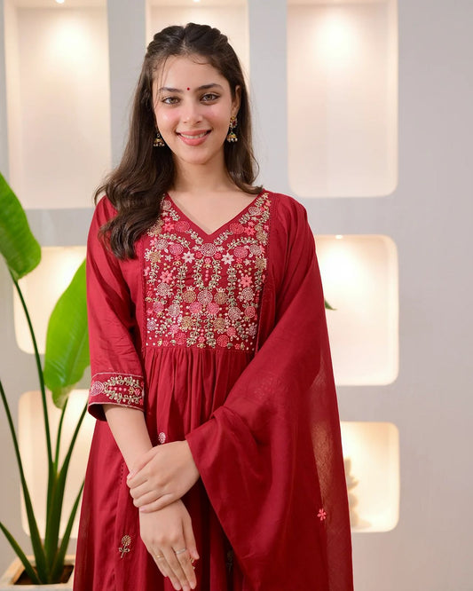 Gulab Threadwork A Line Mul Cotton Suit worn by a smiling woman, showcasing intricate embroidery and elegant design.